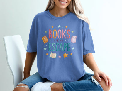 Blue t-shirt with "Books are my escape" and book graphics.
