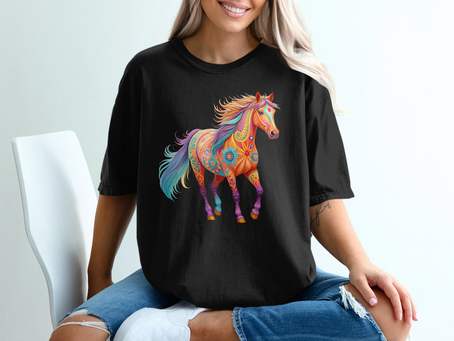 Colorful, floral-patterned horse graphic on a black t-shirt.
