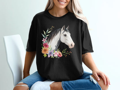 Black t-shirt with a watercolor horse head and floral garland design.