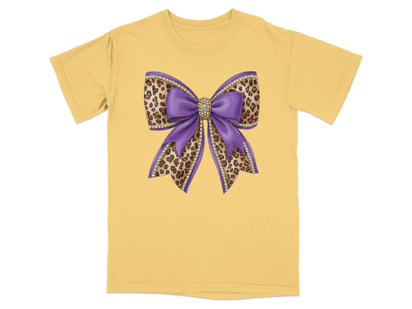 Purple sequin bow with leopard print accents on yellow t-shirt.