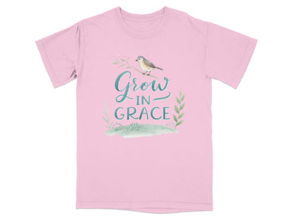 Pink t-shirt with "Grow in Grace" text and bird on a branch.