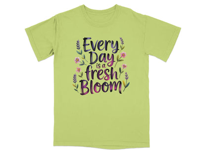 Lime green t-shirt with "Every Day is a Fresh Bloom" text and floral accents.