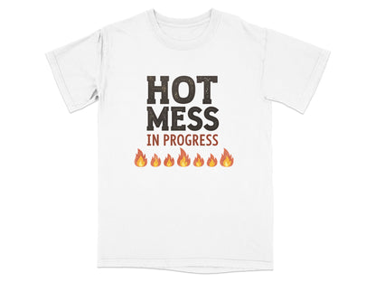 White t-shirt with bold "HOT MESS IN PROGRESS" text and flame graphics.
