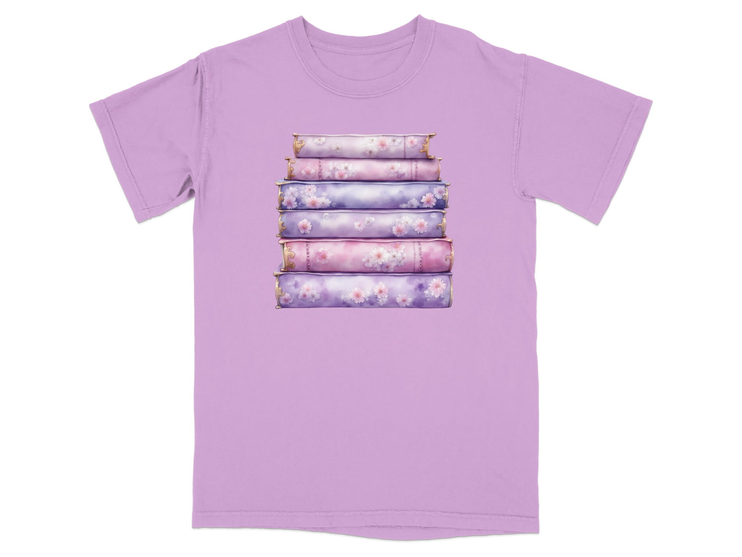 Stack of decorative books with floral accents on a purple t-shirt.