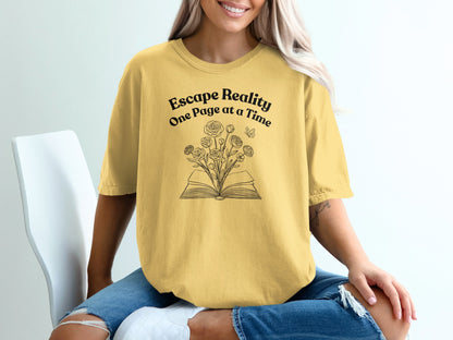 Yellow t-shirt with "Escape Reality One Page at a Time" and open book with flowers design.