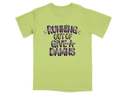 Light green t-shirt with purple text "RUNNING OUT OF GIVE-A-DAMNS".