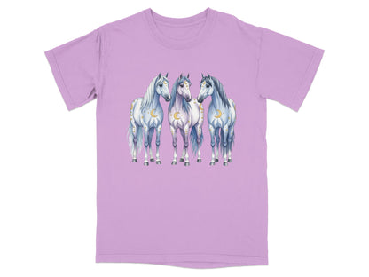 Three white horses with gold moons and stars on a lavender t-shirt.