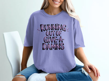 Lavender t-shirt with "RUNNING OUT OF GIVE-A-DAMNS" text.