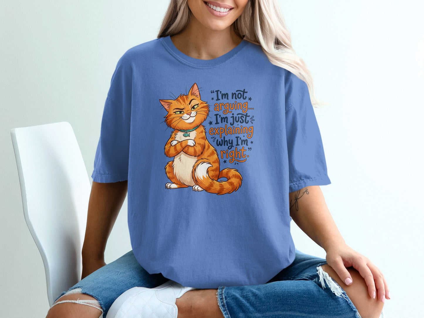 Orange cat with crossed arms on t-shirt states "I'm not arguing... I'm just explaining why I'm right."