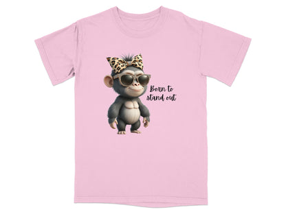 Pink t-shirt with graphic of a chimpanzee wearing sunglasses and a bow, text "Born to stand out".