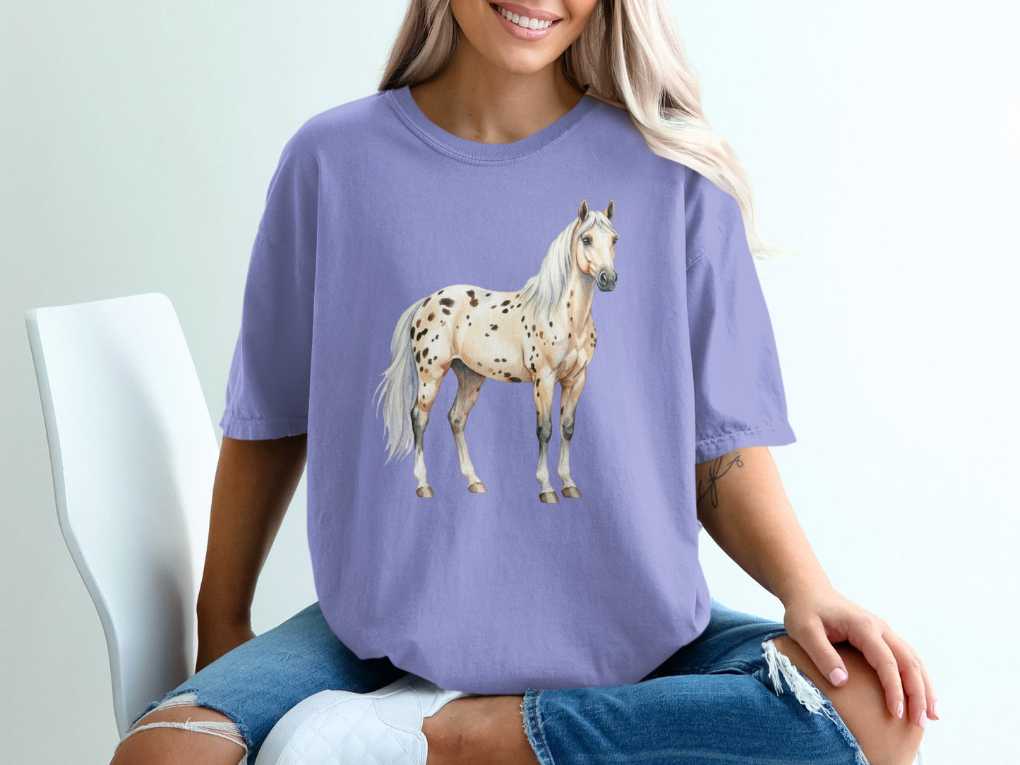 Purple t-shirt with a watercolor Appaloosa horse graphic.