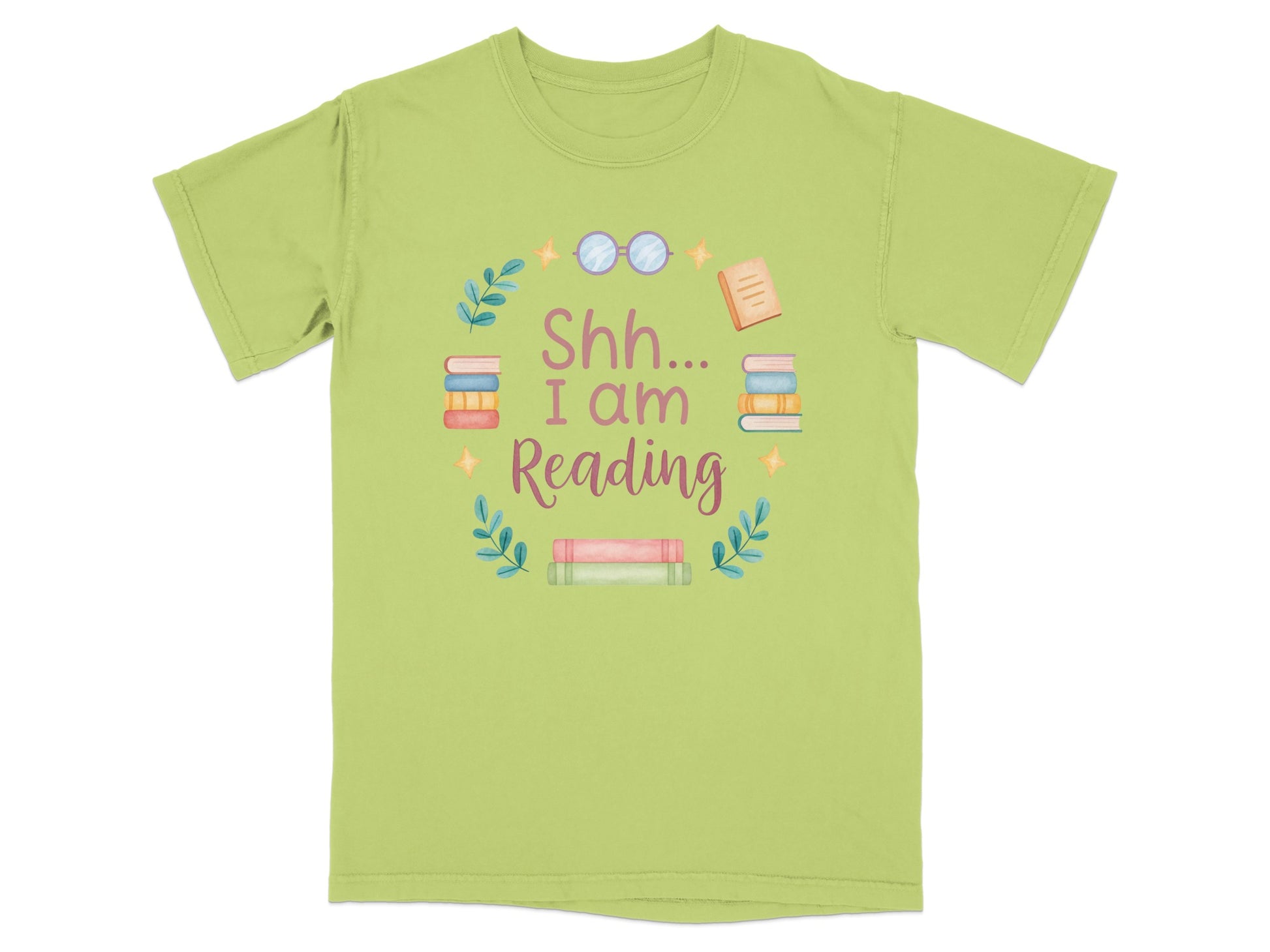 Green t-shirt with "Shh I Am Reading" text surrounded by books and greenery.