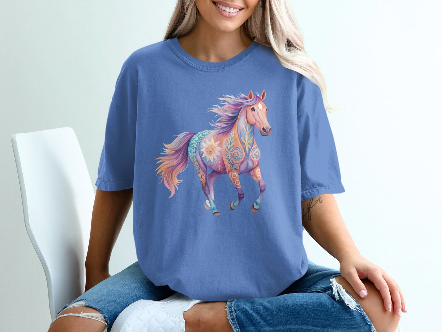 Purple t-shirt with colorful, floral patterned horse graphic.