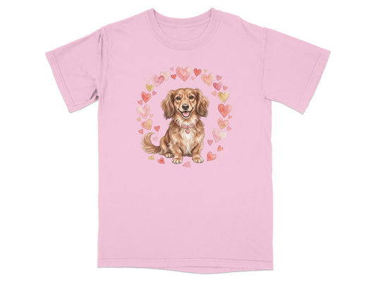 Pink t-shirt with dachshund surrounded by watercolor hearts.