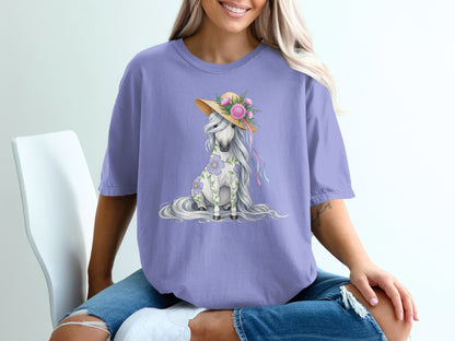 Purple t-shirt featuring a floral unicorn wearing a straw hat.