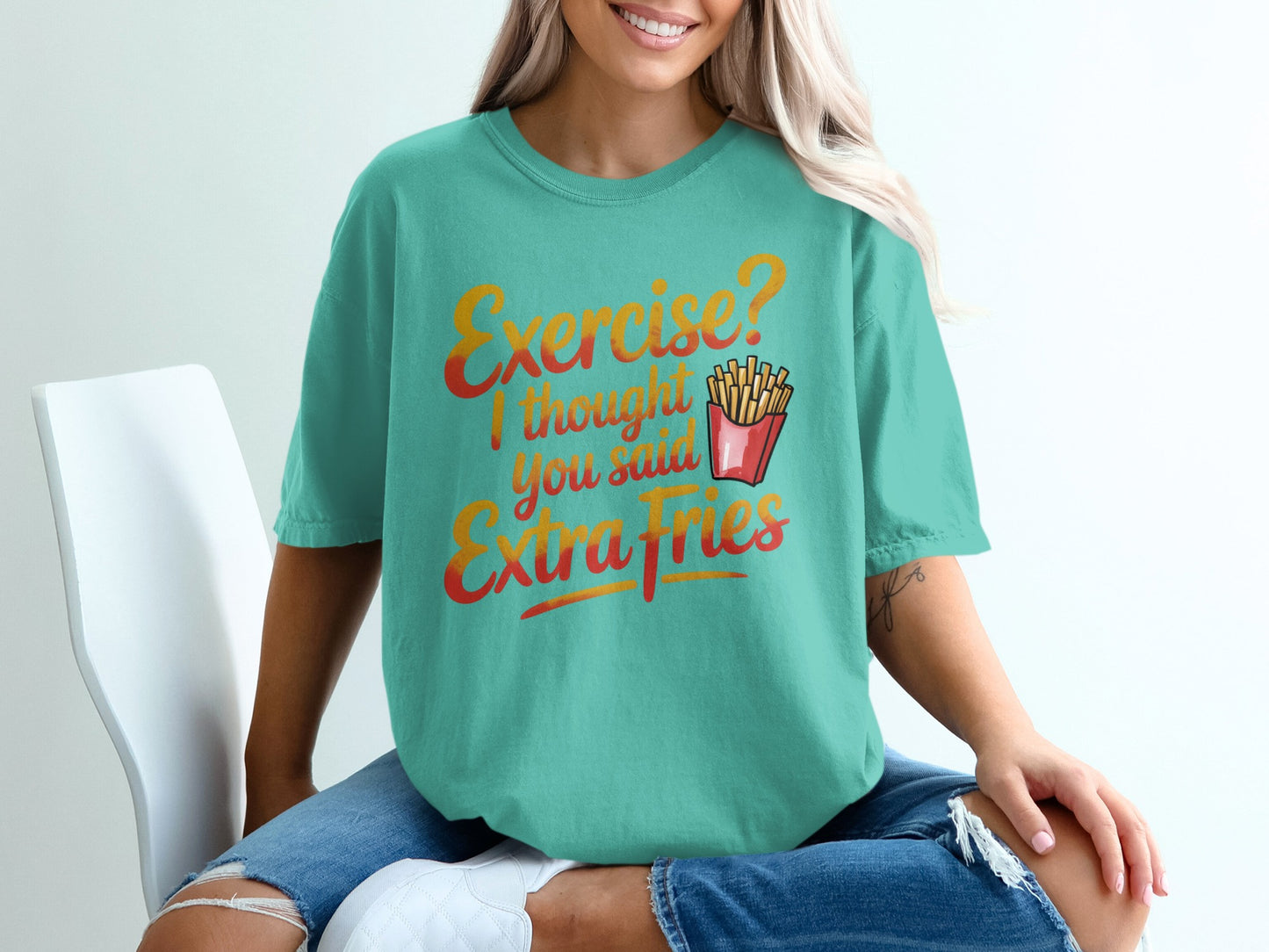 Teal t-shirt with "Exercise? I thought you said Extra Fries" graphic.