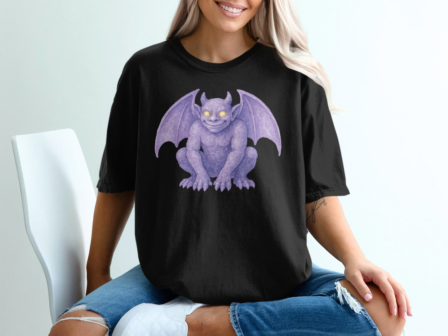 Black t-shirt featuring a purple gargoyle illustration with glowing yellow eyes.