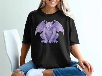 Black t-shirt featuring a purple gargoyle illustration with glowing yellow eyes.