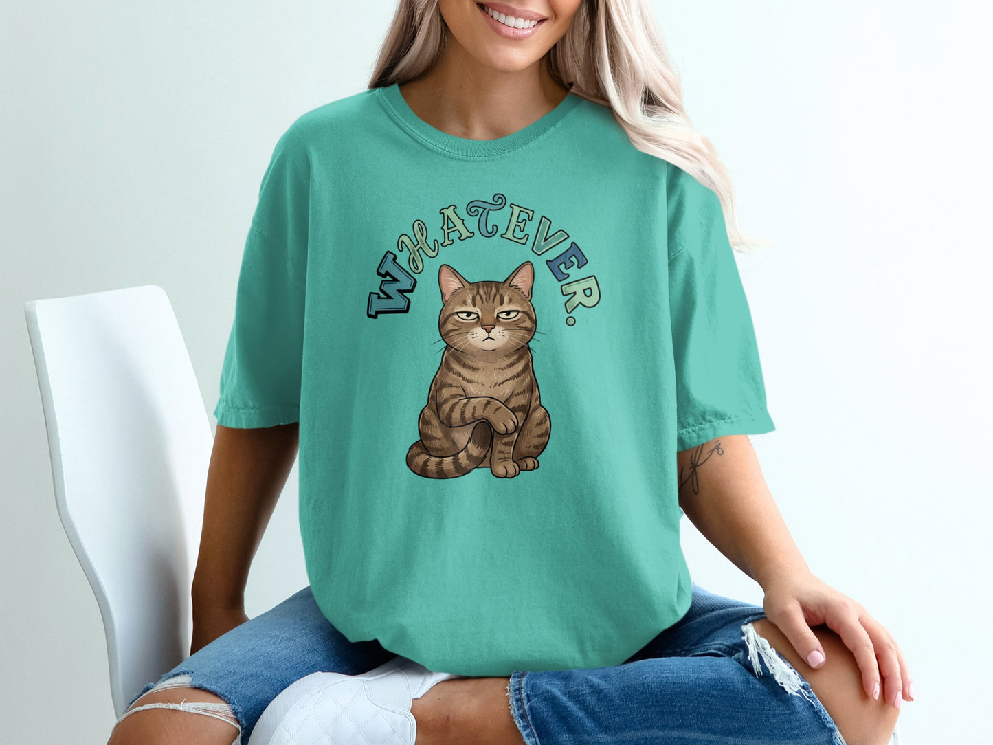 Cat sitting with "WHATEVER" text above.