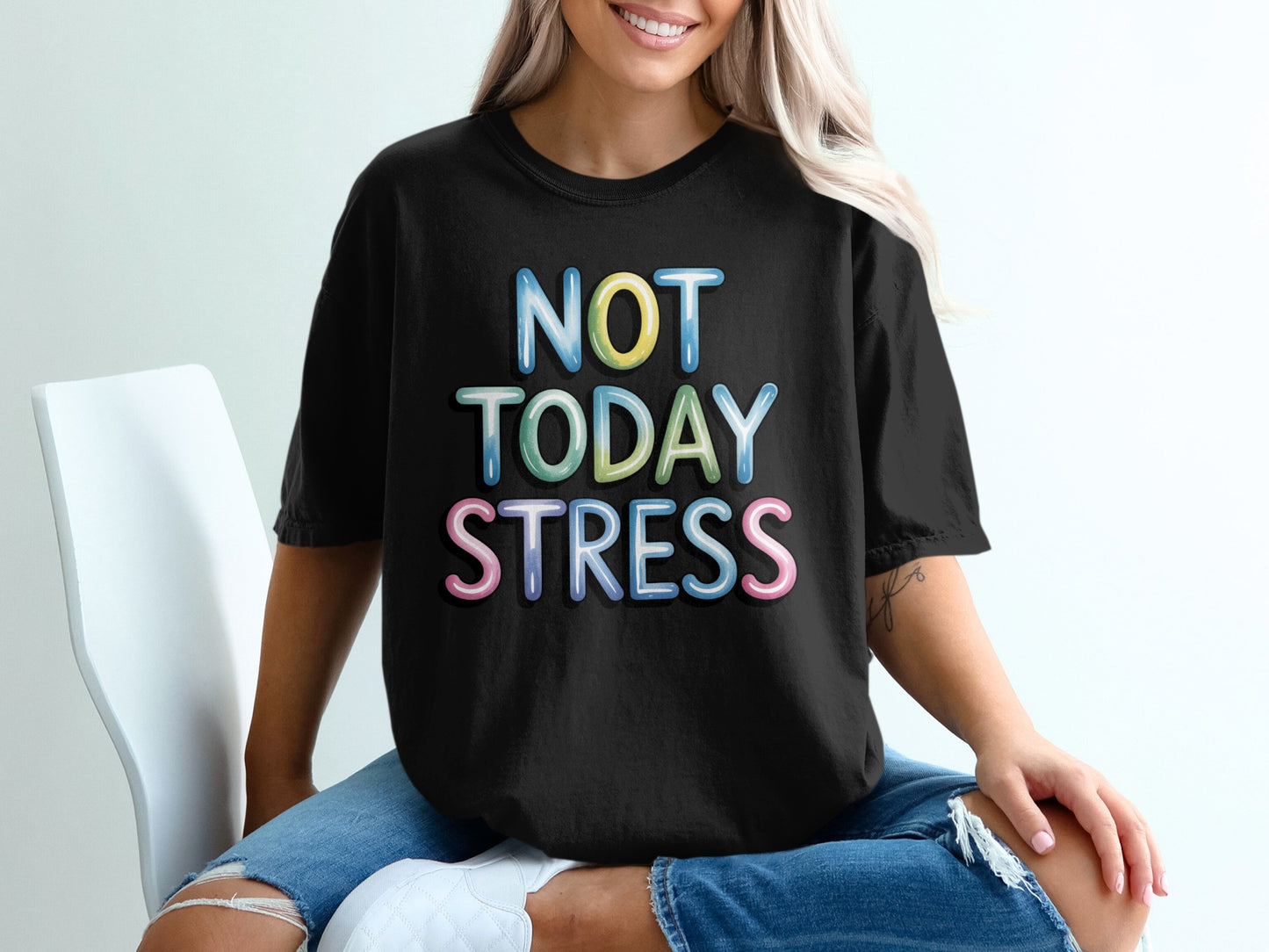 Black t-shirt with colorful "NOT TODAY STRESS" text on a white background.