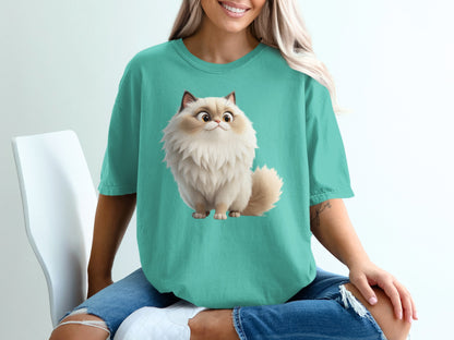 Teal t-shirt featuring a fluffy cartoon cat illustration with big eyes.