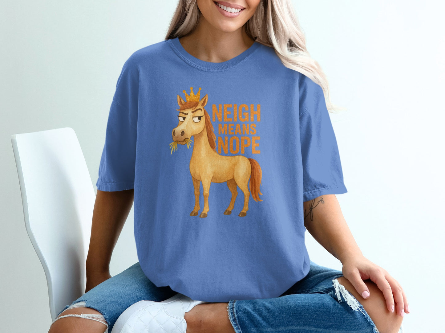 Blue t-shirt with a cartoon horse wearing a crown and the text "NEIGH MEANS HOPE".