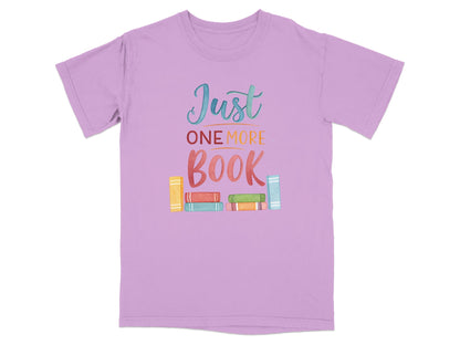Lilac t-shirt with "Just ONE MORE BOOK" text and colorful books.