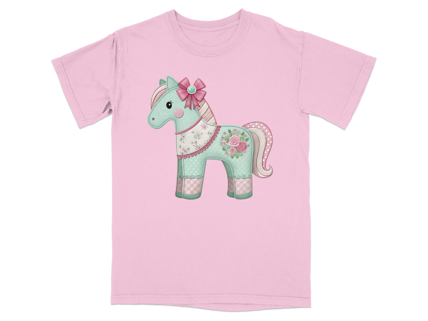 Pink t-shirt with a decorative fabric horse applique featuring flowers and polka dots.