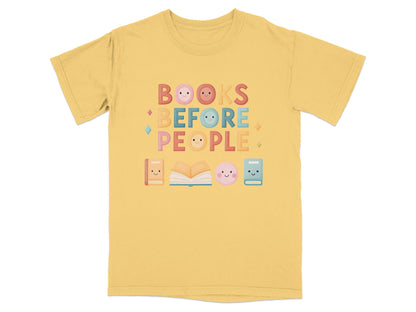Yellow t-shirt with "BOOKS BEFORE PEOPLE" in colorful letters and book icons.