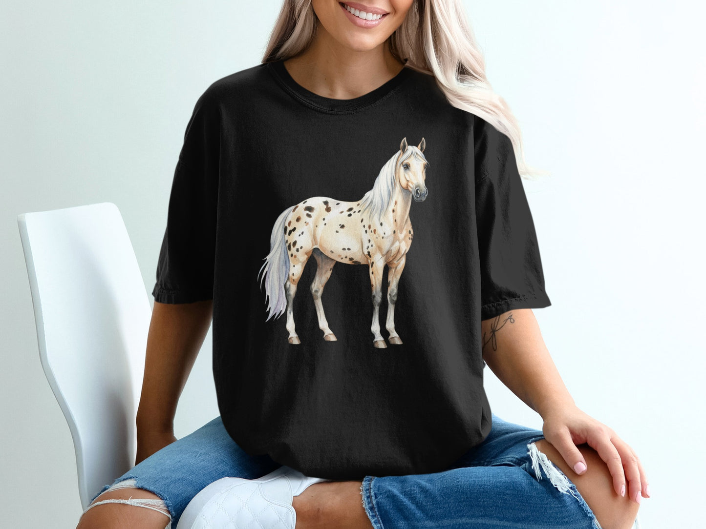 Black t-shirt with a spotted Appaloosa horse graphic.