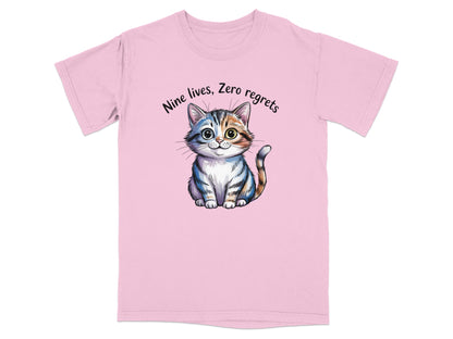 Pink t-shirt with a watercolor-style cat and text "Nine lives, Zero regrets."