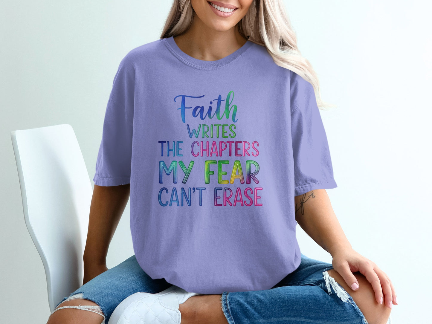 Lavender t-shirt with text "Faith writes the chapters my fear can't erase".