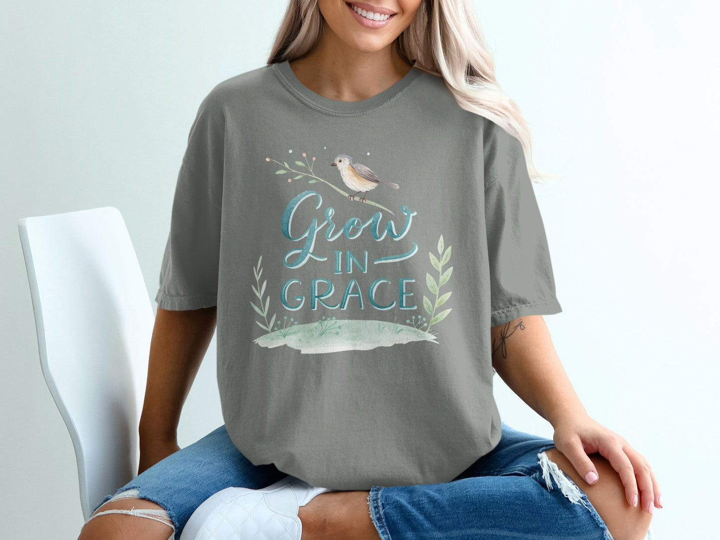 Gray t-shirt with "Grow In Grace" text and bird illustration.