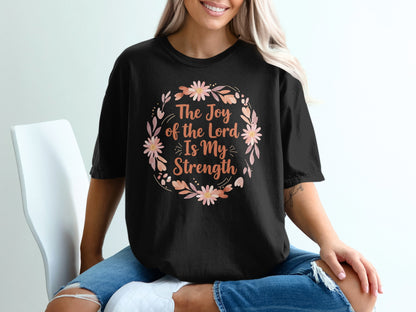 Black t-shirt with "The Joy of the Lord Is My Strength" floral wreath design.