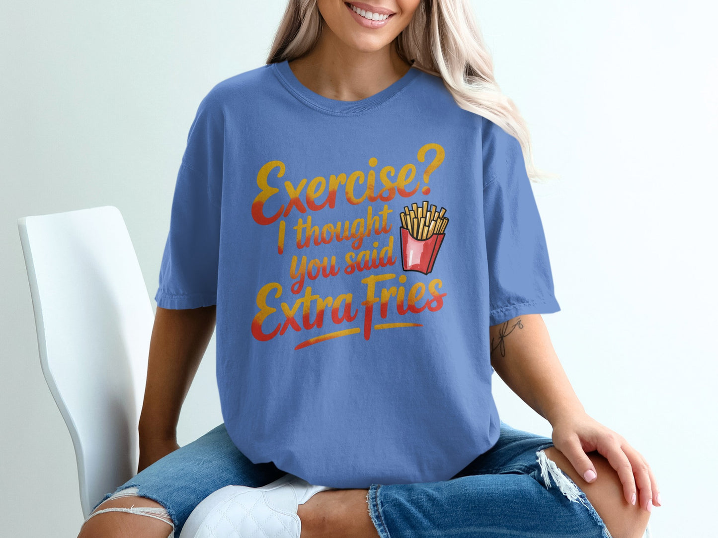 Blue t-shirt with "Exercise? I thought you said Extra Fries" text and french fries.
