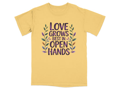 Yellow t-shirt with "Love Grows Best In Open Hands" text and floral design.