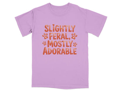 Lavender t-shirt with "Slightly Feral, Mostly Adorable" text and paw prints.