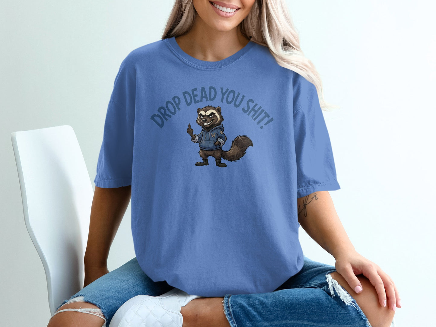 T-shirt with raccoon graphic and "DROP DEAD YOU SHIT!" text.
