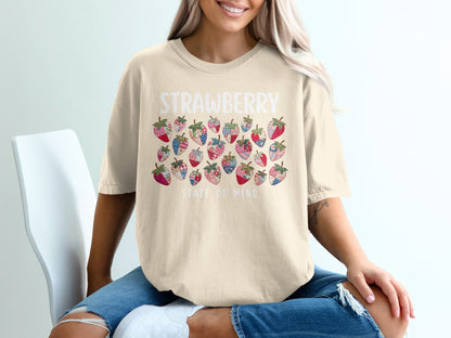 Cream t-shirt with "STRAWBERRY STATE OF MIND" and colorful strawberry pattern.