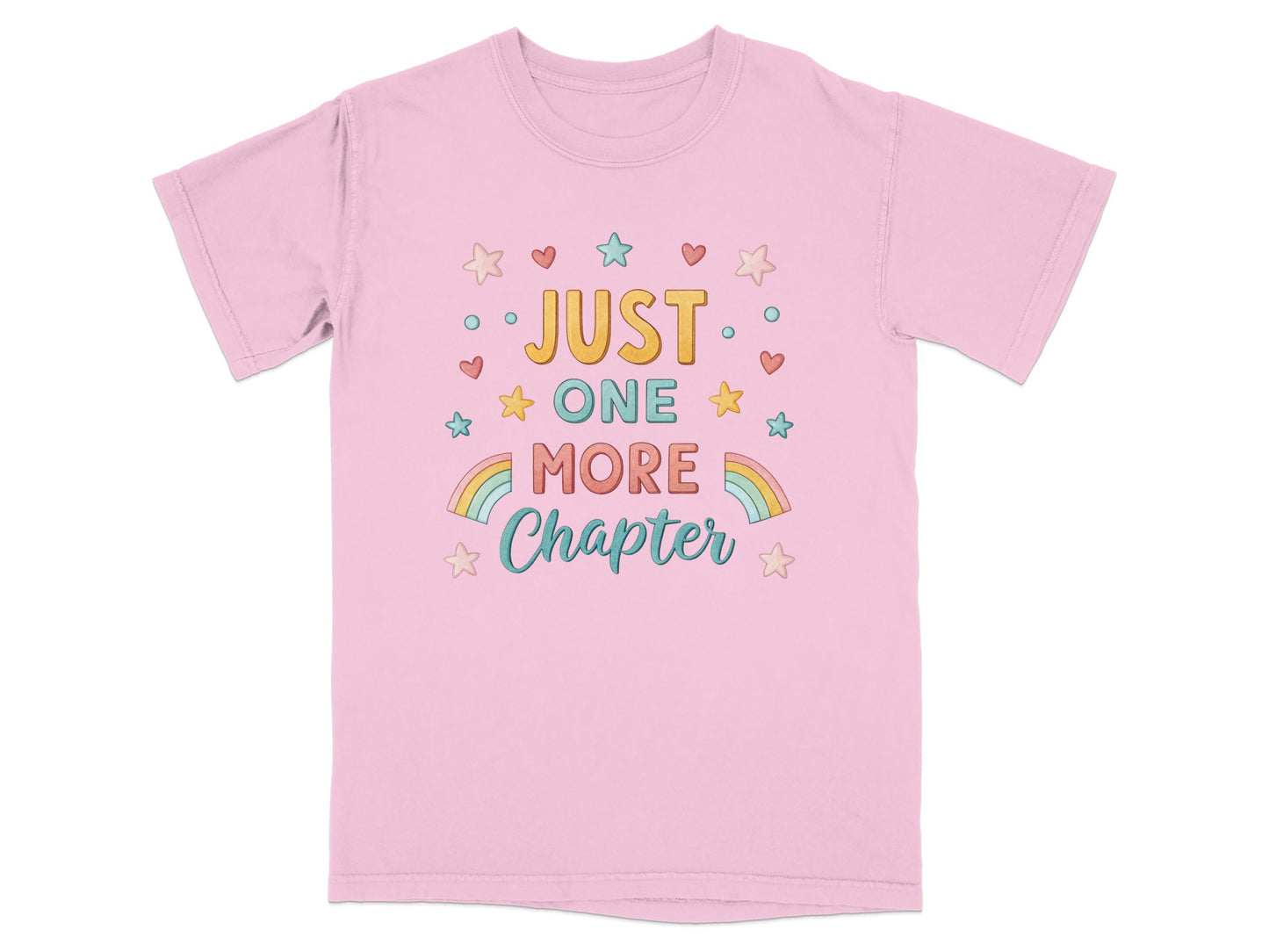 Pink t-shirt with "Just One More Chapter" text and colorful stars and rainbows.