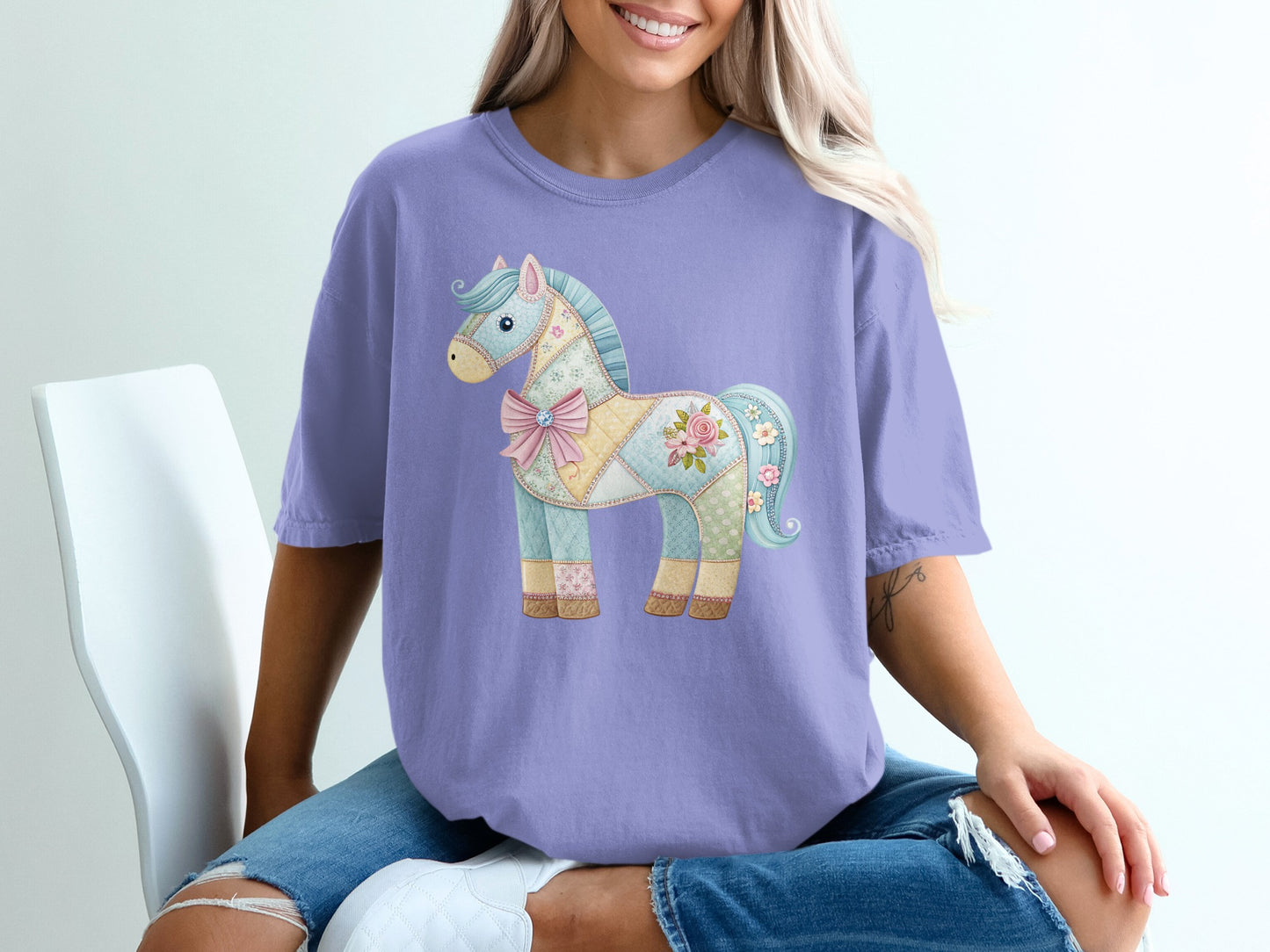 Quilted patchwork horse graphic on a light purple t-shirt.