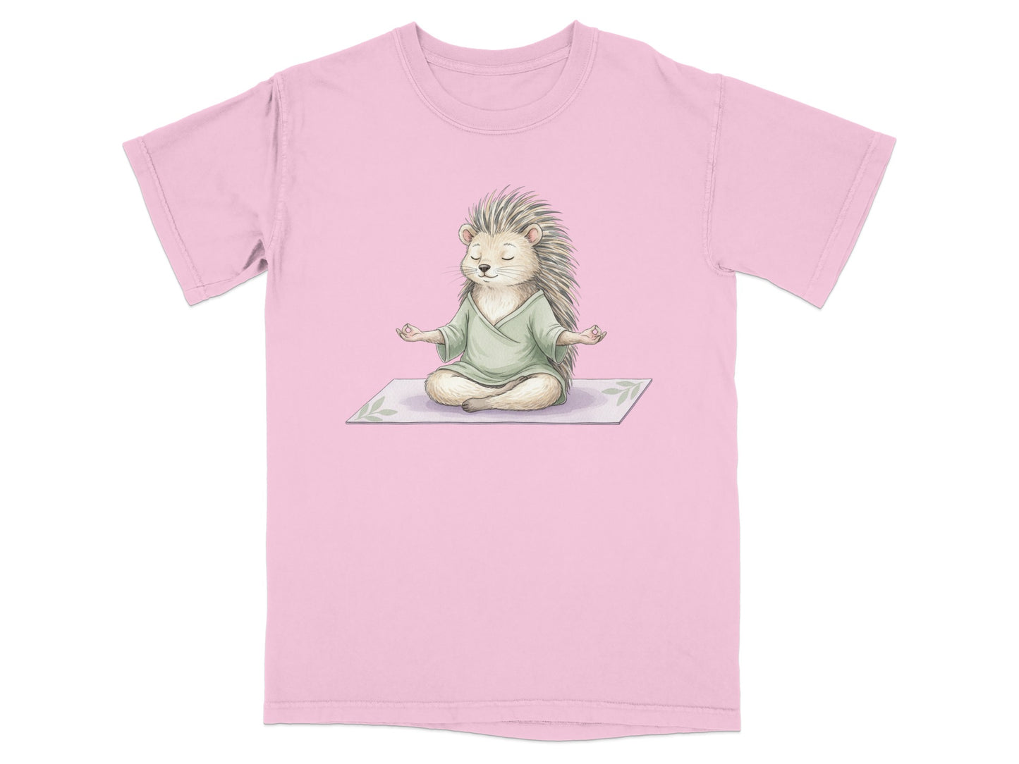 Pink t-shirt with a watercolor illustration of a hedgehog meditating.