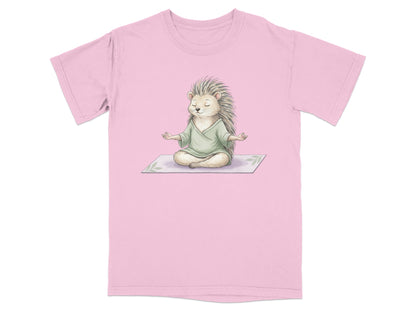 Pink t-shirt with a watercolor illustration of a hedgehog meditating.