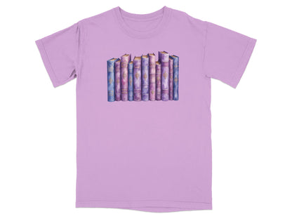 T-shirt with a watercolor illustration of a row of ornate, colorful books.