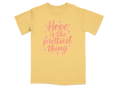 Yellow t-shirt with "Hope is the prettiest thing" in pink text.
