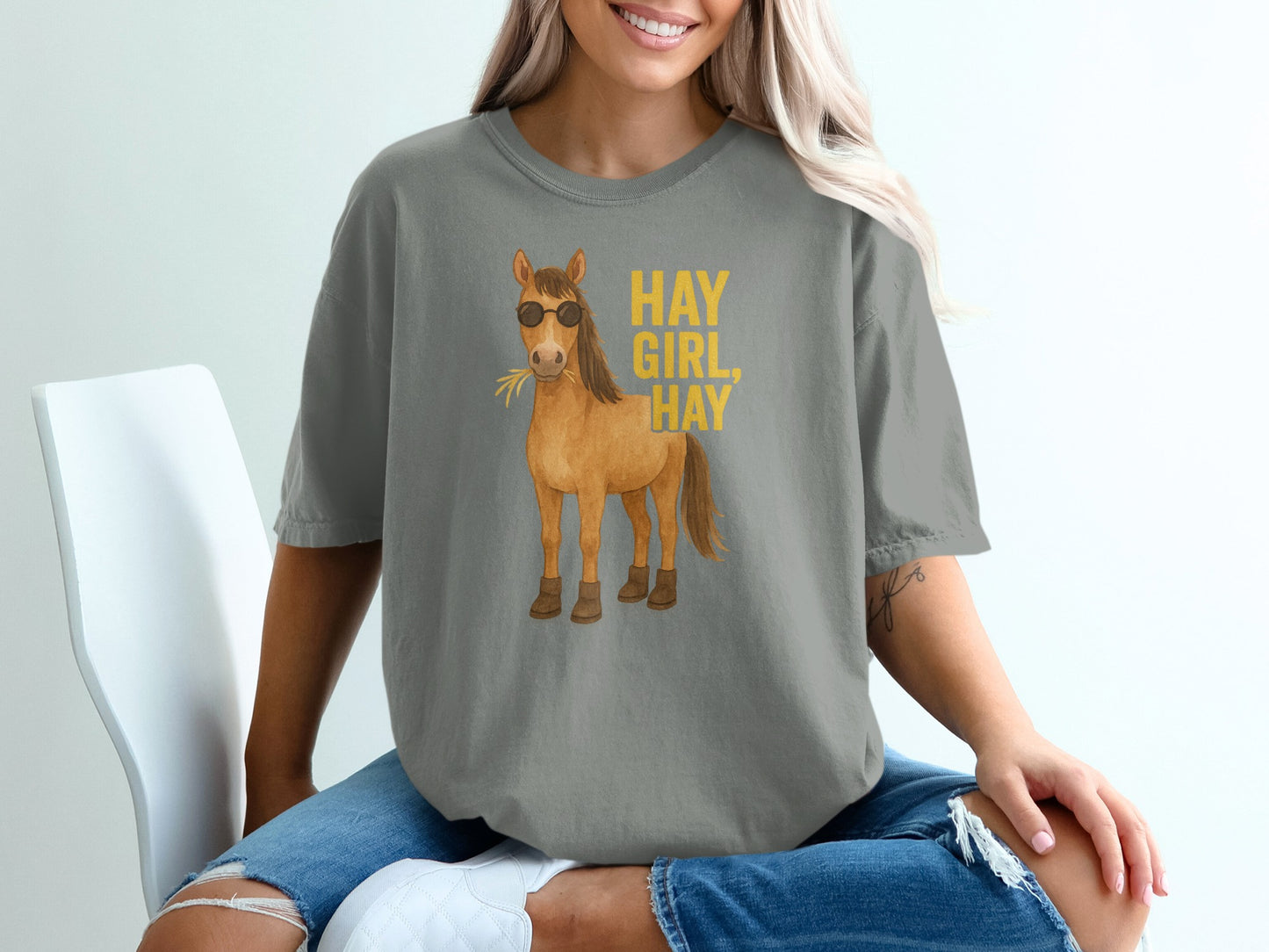 Gray t-shirt with cartoon horse wearing sunglasses and text "HAY GIRL, HAY".