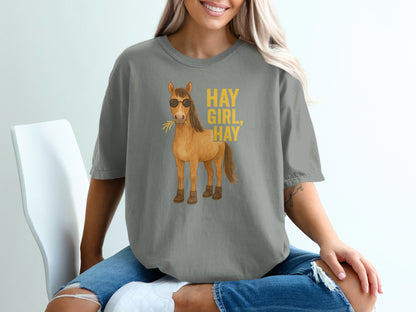 Gray t-shirt with cartoon horse wearing sunglasses and text "HAY GIRL, HAY".