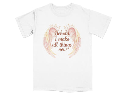 White t-shirt with text "Behold, I make all things new" and pastel wings.