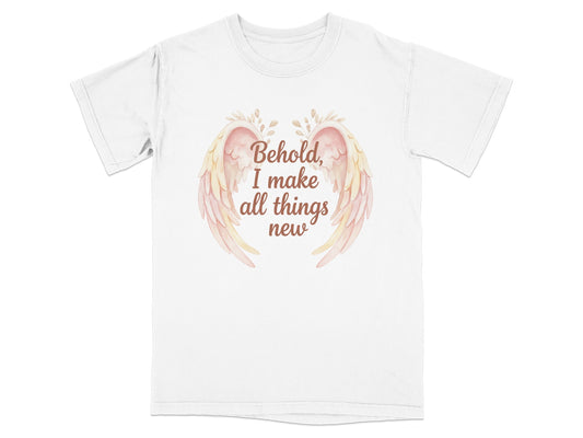 White t-shirt with text "Behold, I make all things new" and pastel wings.