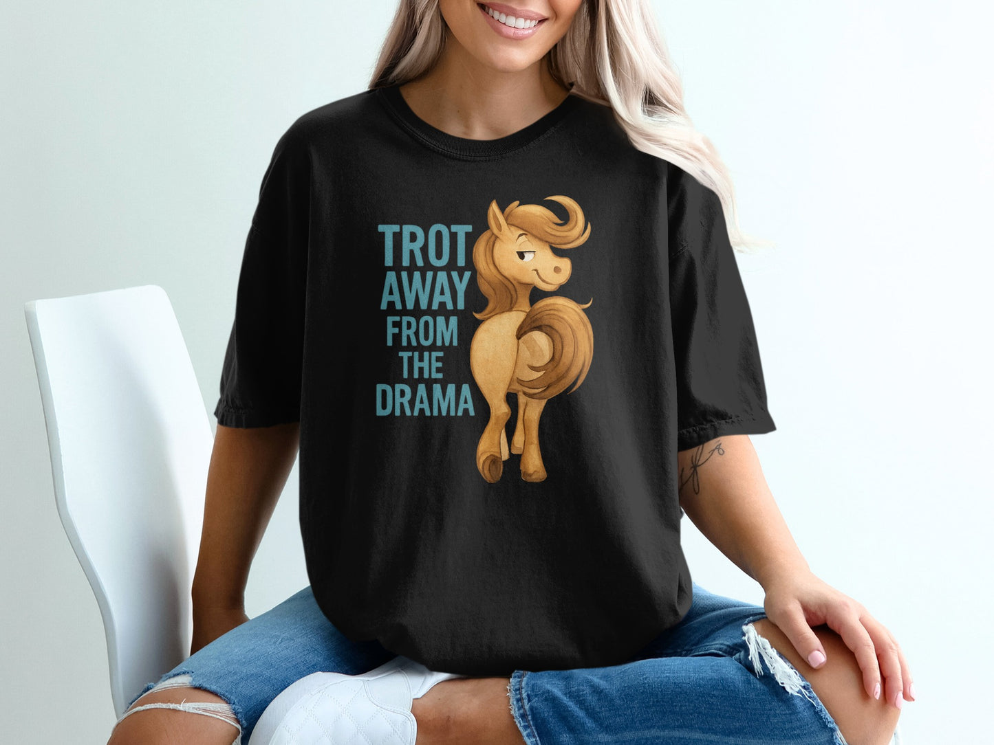 Black t-shirt with text "TROT AWAY FROM THE DRAMA" and a cartoon horse.